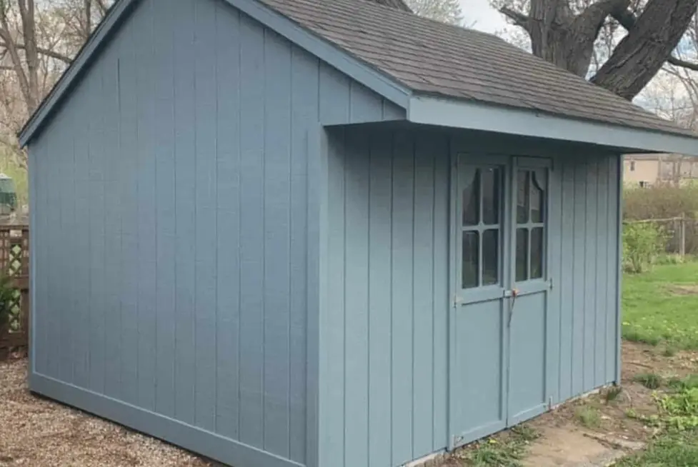 The same shed repainted blue-grey