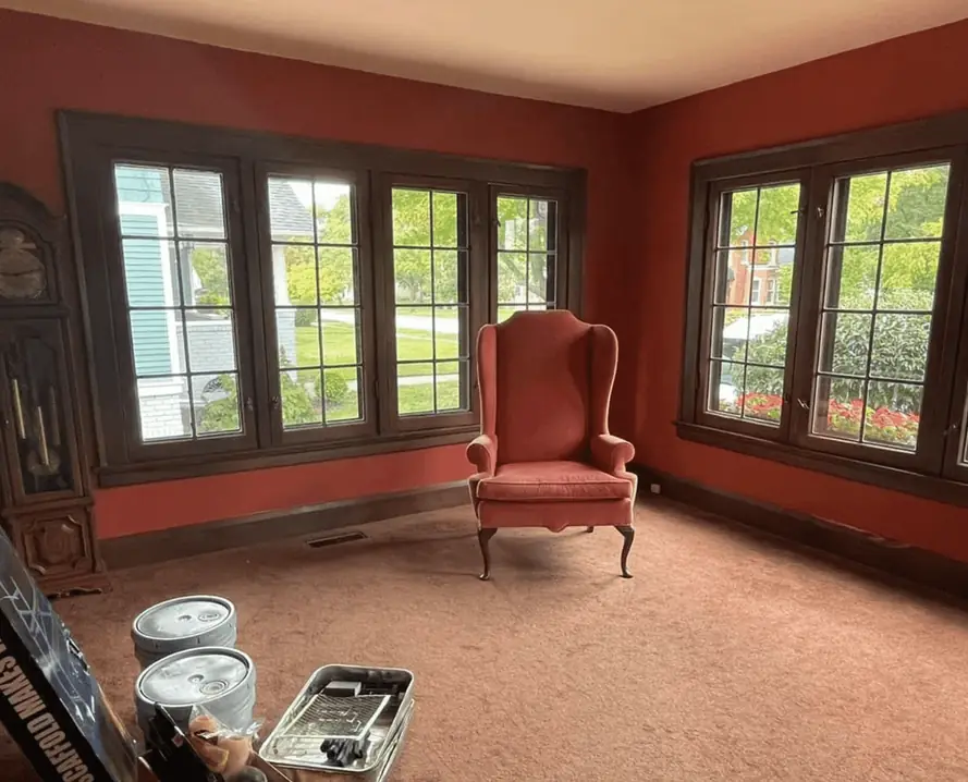 The same living room with deep red walls after painting