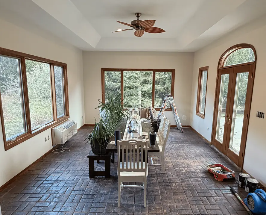 The same sunroom with white walls after painting