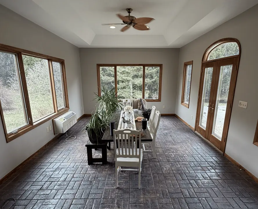 Sunroom with grey walls before painting